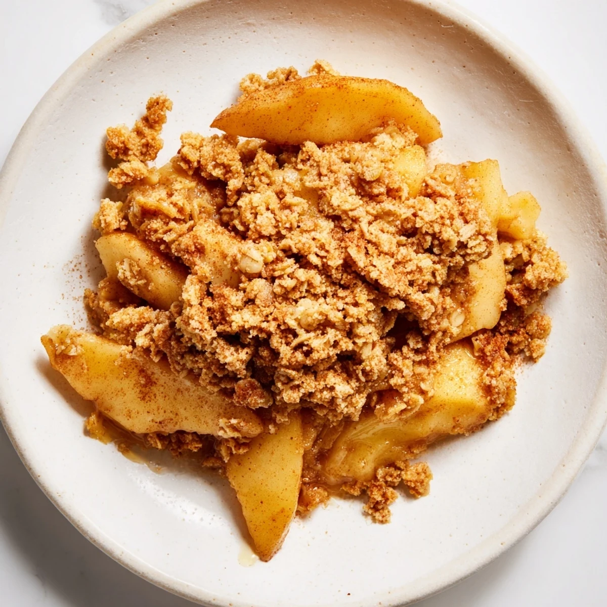 Freshly baked Warm Cinnamon Oat Apple Crisp, a delicious dessert with tender apples and sweet spiced oats.