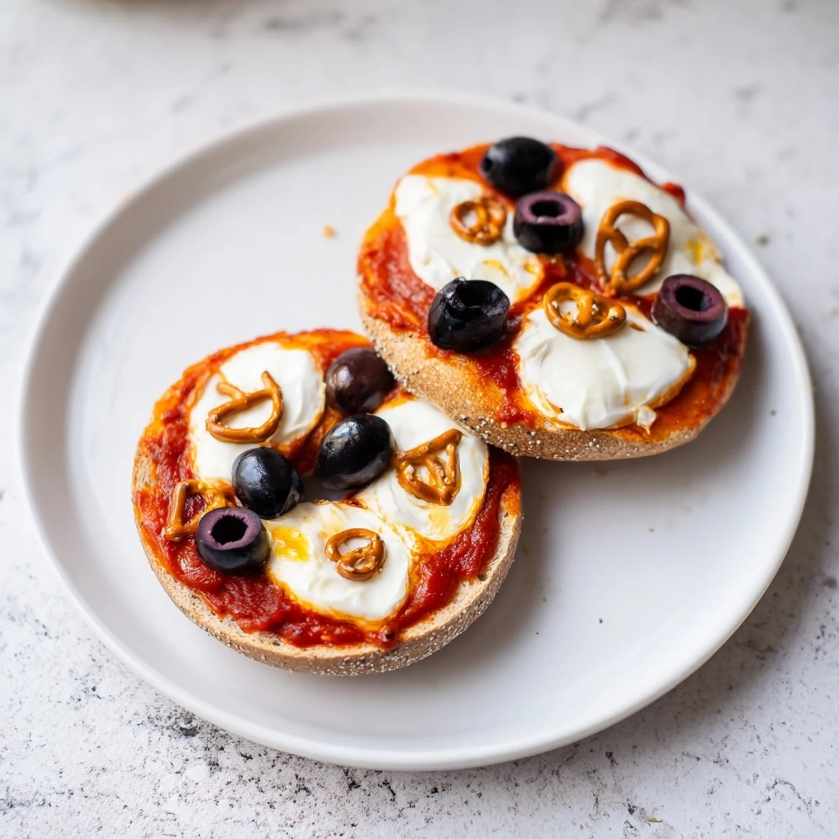 Warm and cheesy reindeer face pizza bagels, festive and fun for holiday gatherings and kid snacks.