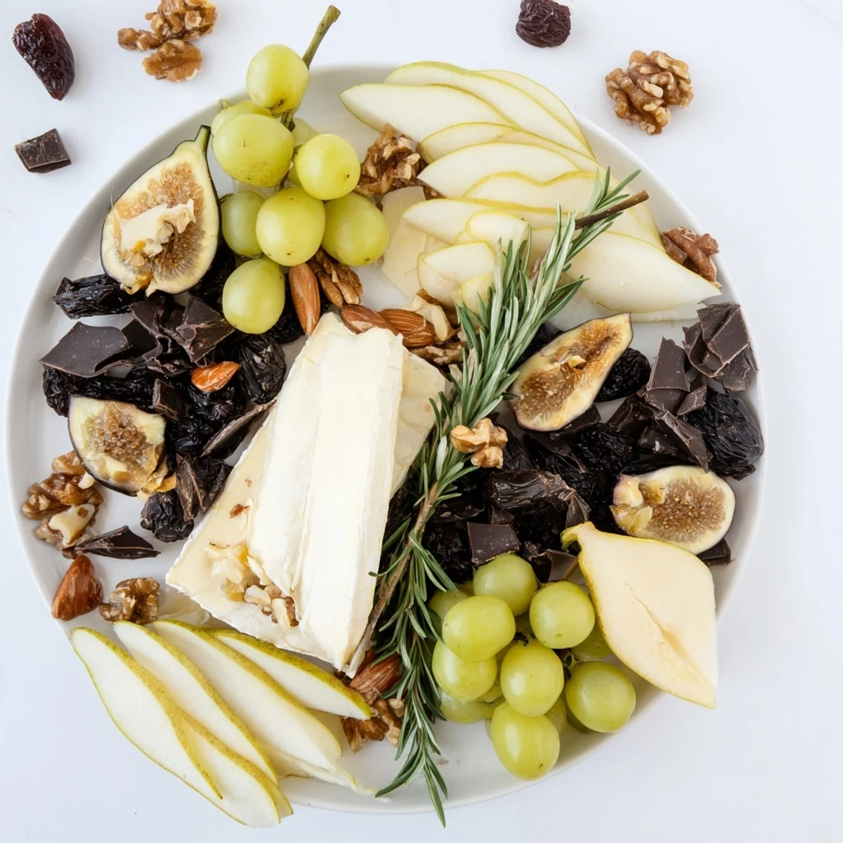 A visually stunning Winter Solstice Board with Brie, pears, and olives, perfect appetizer.