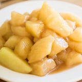 A comforting close-up showing slow cooker stewed apples; a naturally sweet, simple dessert.