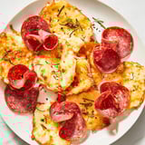 Golden-brown charcuterie chips, a low-carb treat with cured meats and bubbling cheese awaiting your enjoyment.