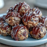 Colorful, bite-sized energy balls packed with oats, seeds, and honey—perfect for allergy-friendly lunchboxes or on-the-go fuel.