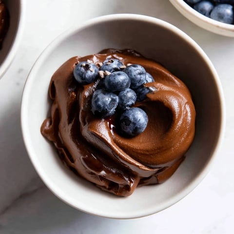 Smooth, dark chocolate avocado mousse, creamy vegan dessert, ready to chill and enjoy.
