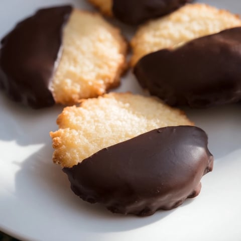 Crisp vanilla wafers dipped in glossy semi-sweet chocolate, a perfect simple cookies treat.