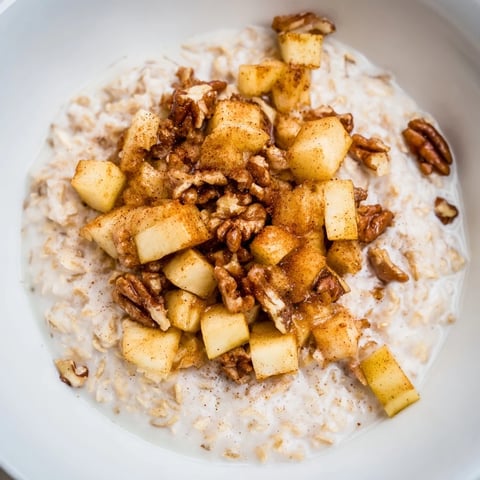 A warm, comforting apple pie oatmeal bowl; delicious creamy oats with sweet, caramelized apples.