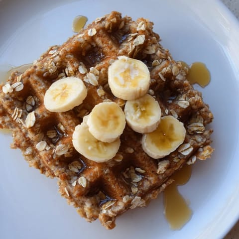 Fluffy and delicious homemade banana oat waffles, a wholesome treat perfect for a family breakfast.