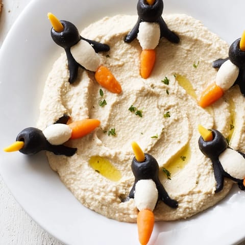 Mediterranean-inspired Winter Dip: imagine smooth white bean dip with cute olive penguins surrounding it.