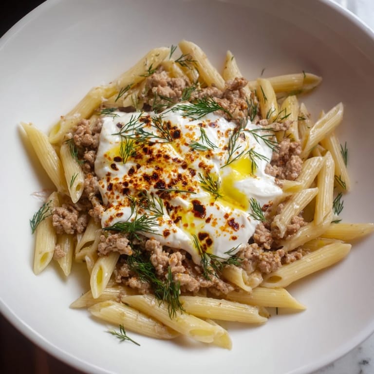 Savory Turkish Pasta with Ground Turkey: forkfuls of pasta and flavorful ground meat, ready to eat.