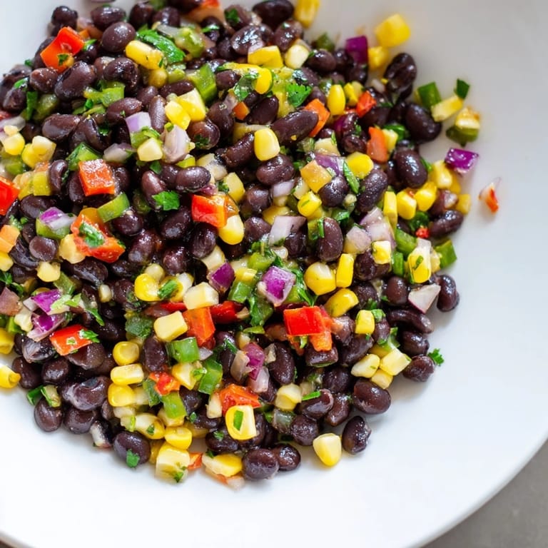 Freshly made Cowboy Caviar Salad, a Southwestern classic, offers a refreshing, flavorful experience.