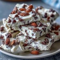 Creamy Greek yogurt and cottage cheese bark studded with chocolate chips, offering a protein-packed cookie dough flavor in every bite.