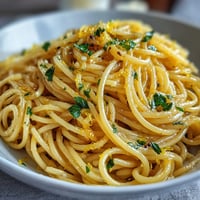 Creamy lemon butter pasta with fresh lemon zest, Parmesan, and silky butter sauce, served hot and ready to enjoy.