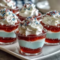 Red, white, and blue 4th of July Firecracker Jello Shots ready to party!